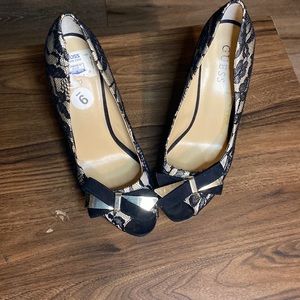 Like new Guess stilettos black lace gold. fits like 8.5